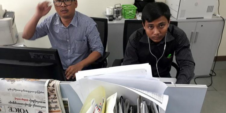 Reuters journalists Wa Lone (L) and Kyaw Soe Oo pose for a picture at the Reuters office in Yangon, Myanmar December 11, 2017. REUTERS