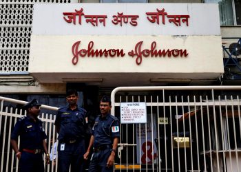 Security guards stand outside the office of Johnson & Johnson in Mumbai, India, August 29, 2018. (REUTERS)