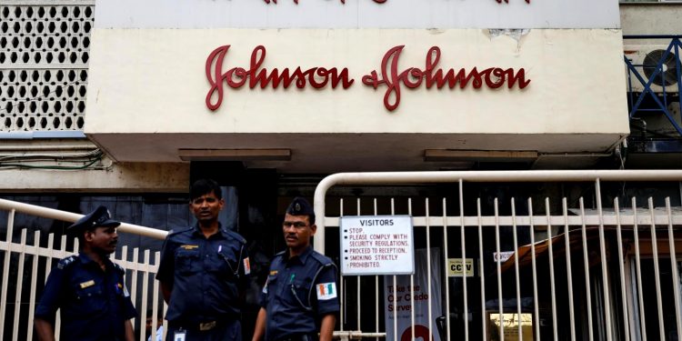 Security guards stand outside the office of Johnson & Johnson in Mumbai, India, August 29, 2018. (REUTERS)