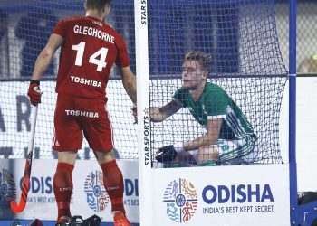 Mark Gleghorne (in red) tries to console his brother Paul after their HWC game at the Kalinga Stadium, Friday