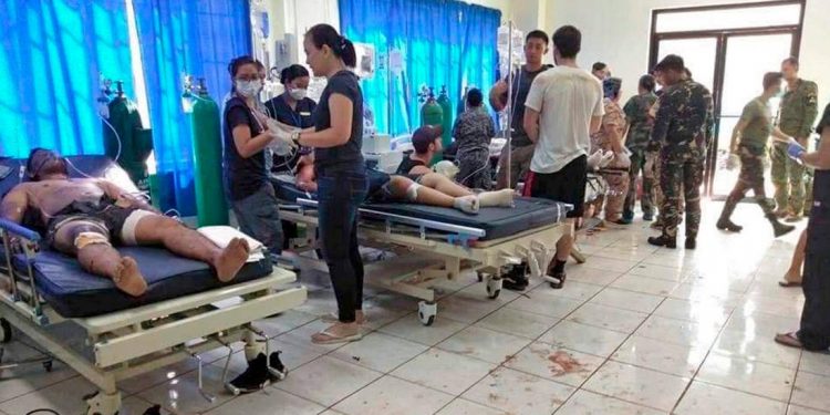 In this photo provided by WESMINCOM Armed Forces of the Philippines, bombing vicitims receive treatment in a hospital after two bombs exploded outside a Roman Catholic cathedral in Jolo, the capital of Sulu province in southern Philippines where militants are active, Sunday, Jan. 27, 2019 killing at least 19 people and wounding nearly 50 during a Sunday Mass, officials said. The first bomb went off in or near the Jolo cathedral in the provincial capital, followed by a second blast outside the compound as government forces were responding to the attack, security officials said. (AP)