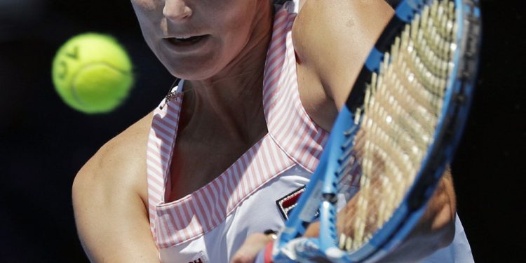 Karolina Pliskova of the Czech Republic makes a backhand return to United States' Serena Williams during their quarterfinal match at the Australian Open tennis championships in Melbourne, Australia, Wednesday, Jan. 23, 2019. (AP)