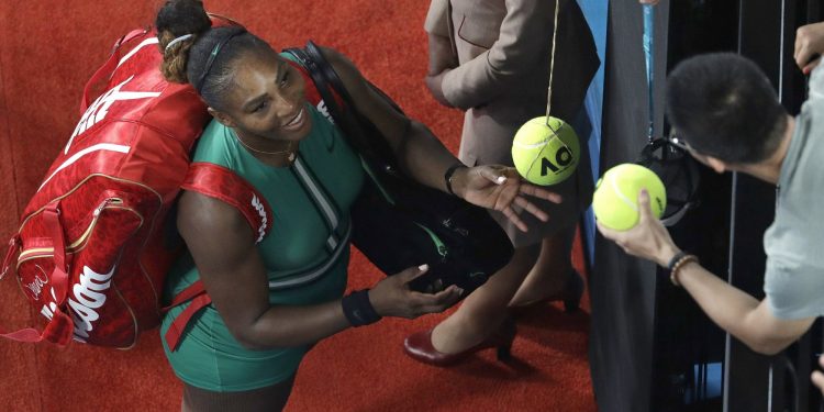 United States' Serena Williams signs autographs after defeating Romania's Simona Halep in their fourth round match at the Australian Open tennis championships in Melbourne, Australia, Monday, Jan. 21, 2019. (AP)