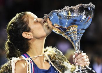 Julia Goerges kisses the trophy after winning against Bianca Andreescu in the final in Auckland, Sunday