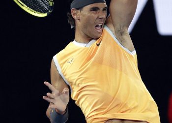 Rafael Nadal makes a forehand return to Frances Tiafoe during their quarterfinal match at the Australian Open in Melbourne, Tuesday