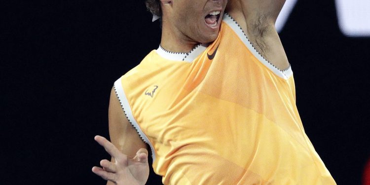 Rafael Nadal makes a forehand return to Frances Tiafoe during their quarterfinal match at the Australian Open in Melbourne, Tuesday