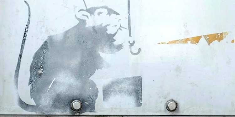 The Tokyo government is trying to verify if the drawing of a rat on one of the city's monorail stations was created by Banksy (AFP)