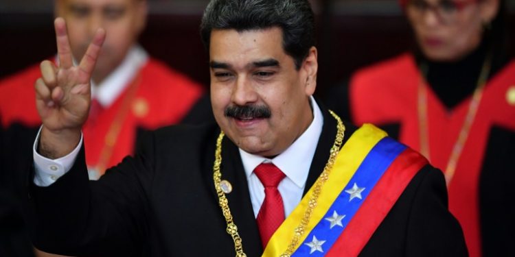 Venezuela's President Nicolas Maduro flashes the victory sign after being sworn-in at the start of a second six-year term (AP)