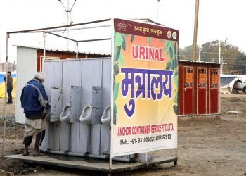 A devotee uses a newly established portable toilet in Kumbh Mela 2019 (AP)