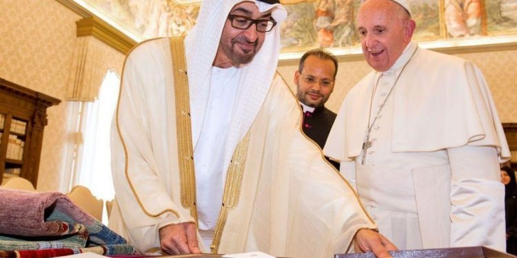 Pope Francis (R) exchanges gifts with Crown Prince of Abu Dhabi Mohammed bin Zayed bin Sultan Al-Nahyan (L), during a private audience at the Vatican in 2016. (AP)