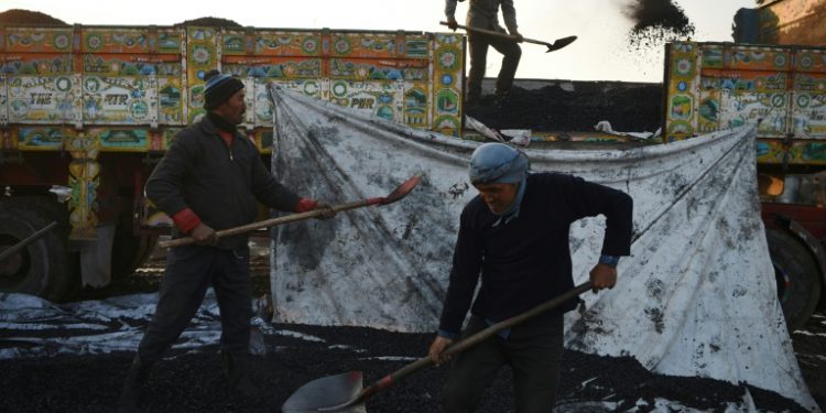 The burning of coal contributes to the smog, which reduces visibility and makes breathing difficult