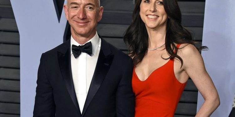 In this March 4, 2018 file photo, Jeff Bezos and wife MacKenzie Bezos arrive at the Vanity Fair Oscar Party in Beverly Hills, Calif. Bezos says he and his wife, MacKenzie, have decided to divorce after 25 years of marriage. Bezos, one of the world’s richest men, made the announcement on Twitter Wednesday, Jan. 9, 2019. (AP)