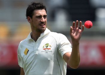 Mitchell Starc takes the ball before bowling to Pakistan (AP)
