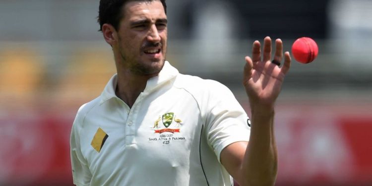 Mitchell Starc takes the ball before bowling to Pakistan (AP)