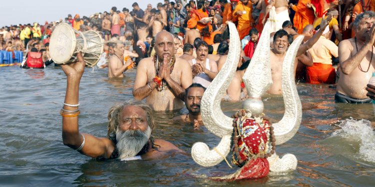 PRAYAGRAJ (ALLAHABAD) JAN 15 (UNI)- Naga Sadhus taking Holy dip at Sangam during the 1st Shahi Snan (Royal Bath) of the Kumbh -2019 on the occasion of Makar Sankrinti in Prayagraj on Tuesday. UNI PHOTO-37u
