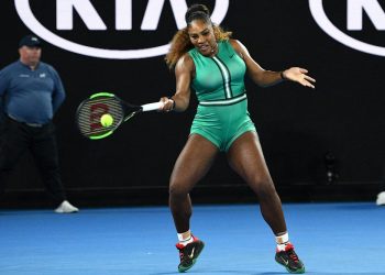 Serena Williams plays a return during her Australian Open match against Simona Halep (not in pic) in Melbourne, Monday