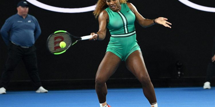 Serena Williams plays a return during her Australian Open match against Simona Halep (not in pic) in Melbourne, Monday