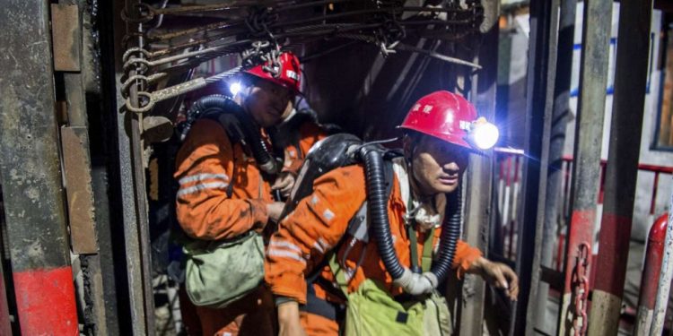 Rescue workers at the site of the mining accident, Saturday at Shaanxi province in China