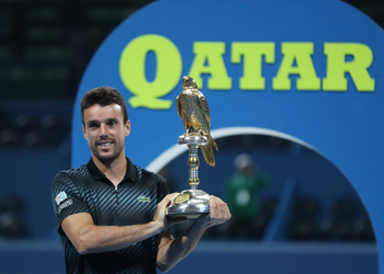 Roberto Bautista Agut poses with the winner’s trophy at Doha, Saturday