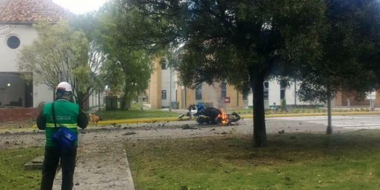 In this image provided by military personnel, flames rise from a deadly car bombing at a police academy