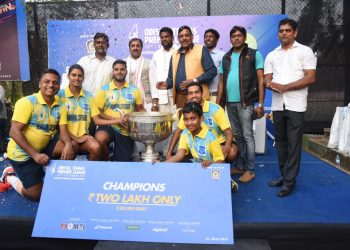 Kendrapara Contendors players and officials pose with the winners’ cheque and the trophy at the Kalinga Stadium tennis complex, Sunday    