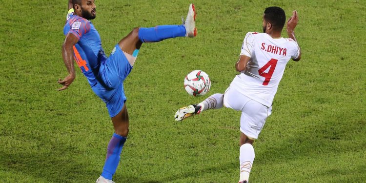 India's Pronay Halder (L) and Bahrain's Sayed Dhiya Saeed in action during their match in Sharjah, Monday