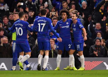 Chelsea goal scorers Pedro (No.11) and Willian rejoice after the former’s goal against Newcastle United as teammates Eden Hazard and Mateo Kovacic come in to join them in celebration, Saturday