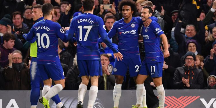 Chelsea goal scorers Pedro (No.11) and Willian rejoice after the former’s goal against Newcastle United as teammates Eden Hazard and Mateo Kovacic come in to join them in celebration, Saturday
