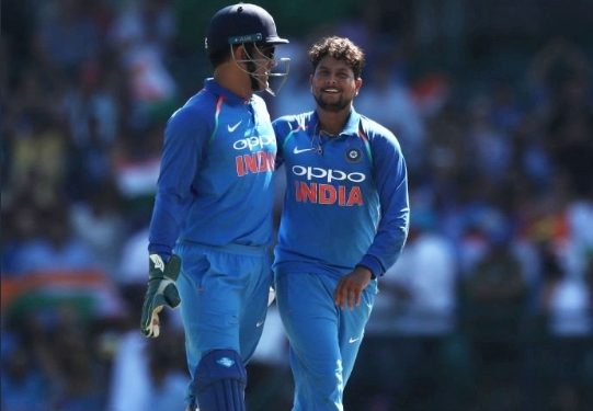 MS Dhoni congratulates Kuldeep Yadav (right) after the latter dismissed an Australian batsman at the SCG, Saturday   