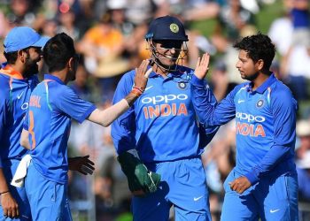 Kuldeep Yadav (R) celebrates after picking up a wicket, Wednesday