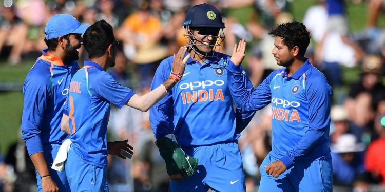 Kuldeep Yadav (R) celebrates after picking up a wicket, Wednesday