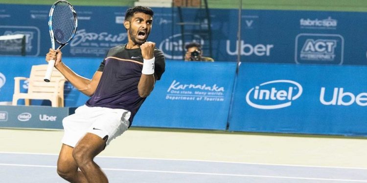 Prajnesh Gunneswaran celebrates after beating Enrique Lopez Perez in Melbourne, Thursday