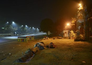 people sleeping on road