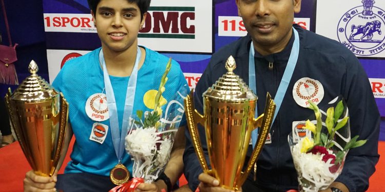 Archana Kamath (L) and Sharath Kamal pose with their trophies and medals at Cuttack, Wednesday