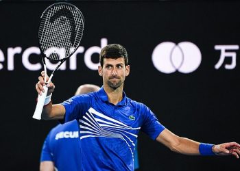 Top seed Novak Djokovic acknowledges the crowd after the conclusion of his quarterfinal match against Kei Nishikori in Melbourne, Wednesday