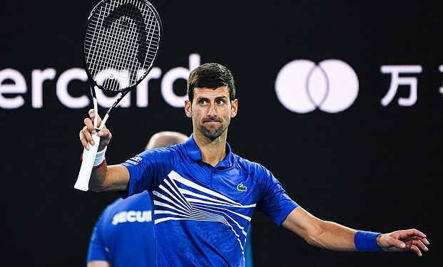 Top seed Novak Djokovic acknowledges the crowd after the conclusion of his quarterfinal match against Kei Nishikori in Melbourne, Wednesday