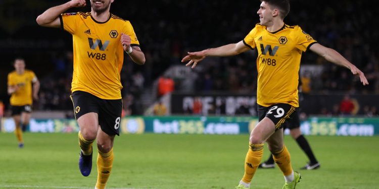 Ruben Neves (L) celebrates scoring his Wolves's second goal with Ruben Vinagre during the Emirates FA Cup, third round match against Liverpool at Molineux Stadium