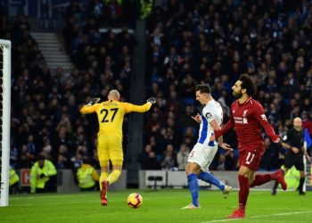 Liverpool's Mohamed Salah celebrates opening the scoring against Brighton (AFP)