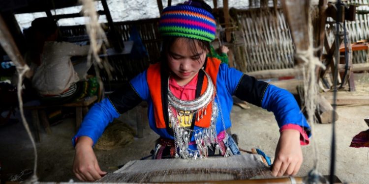 A textile cooperative in northern Vietnam's Quan Ba district provides hope, income, and purpose to women of the Vietnamese Hmong hill tribes many of whose lives have been blighted by people trafficking (AFP)