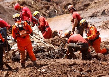 Rescue workers continue their search at the dam disaster side