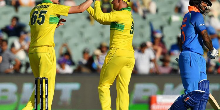 Australians celebrate after the dismissal of Shikhar Dhawan