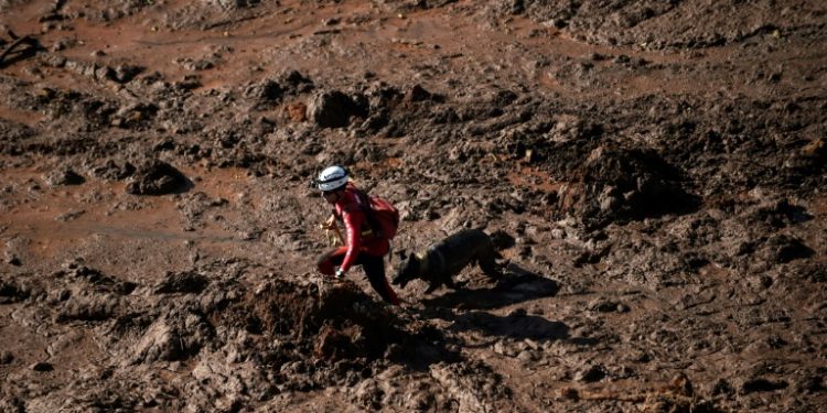 Rescuers struggled to find bodies amid the thick mud after the collapse of a dam at Vale's iron ore mine near the town of Brumadinho, in Minas Gerias state
