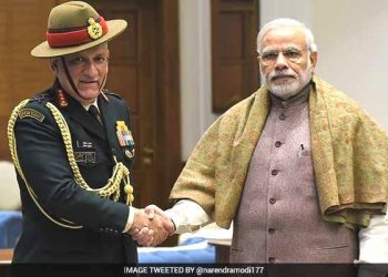 Prime Minister Narendra Modi and Army Chief Gen. Bipin Rawat (L)