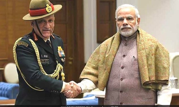 Prime Minister Narendra Modi and Army Chief Gen. Bipin Rawat (L)