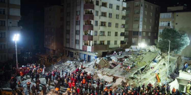 Dozens of rescuers have been working at the site with a crane lifting huge blocks of concrete to clear the rubble and search for survivors (AFP)