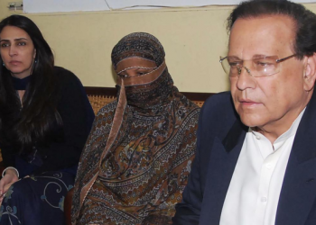 Aasia Bibi (C) has been transferred from a secret location near the capital to another in Karachi, but is still unable to leave the country to join her daughters in Canada. (AFP)