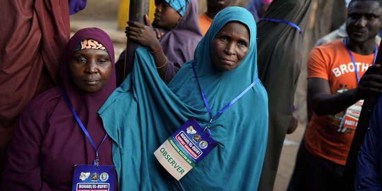 Nigerian election observers watch votes being counted in Kaduna, Nigeria, Saturday Feb. 23, 2019. Incumbent President Muhammadu Buhari is facing opposition presidential candidate Atiku Abubakar in the presidential election. (AP)