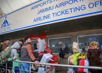 Passengers stranded outside Jammu airport after it was closed for civilian operations amid tension along the Pakistan border, Wednesday. 			 PTI Photo