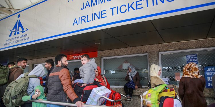 Passengers stranded outside Jammu airport after it was closed for civilian operations amid tension along the Pakistan border, Wednesday. 			 PTI Photo
