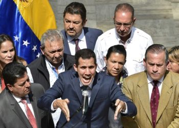 Venezuela's opposition leader and self-proclaimed acting president Juan Guaido speaks to the press at the Federal Legislative Palace, in Caracas, on February 4, 2019 (AFP)